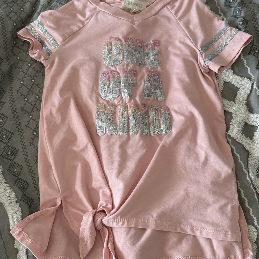 Between one of a kind t shirt size 8